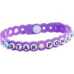 Customized purple bracelet with smiley face and star charms that say star power
