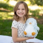 a child holing feathers sky penguin