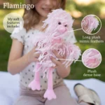 A girl holding Feathers pink Flamingo showing its long plush feathers and dense plush base.
