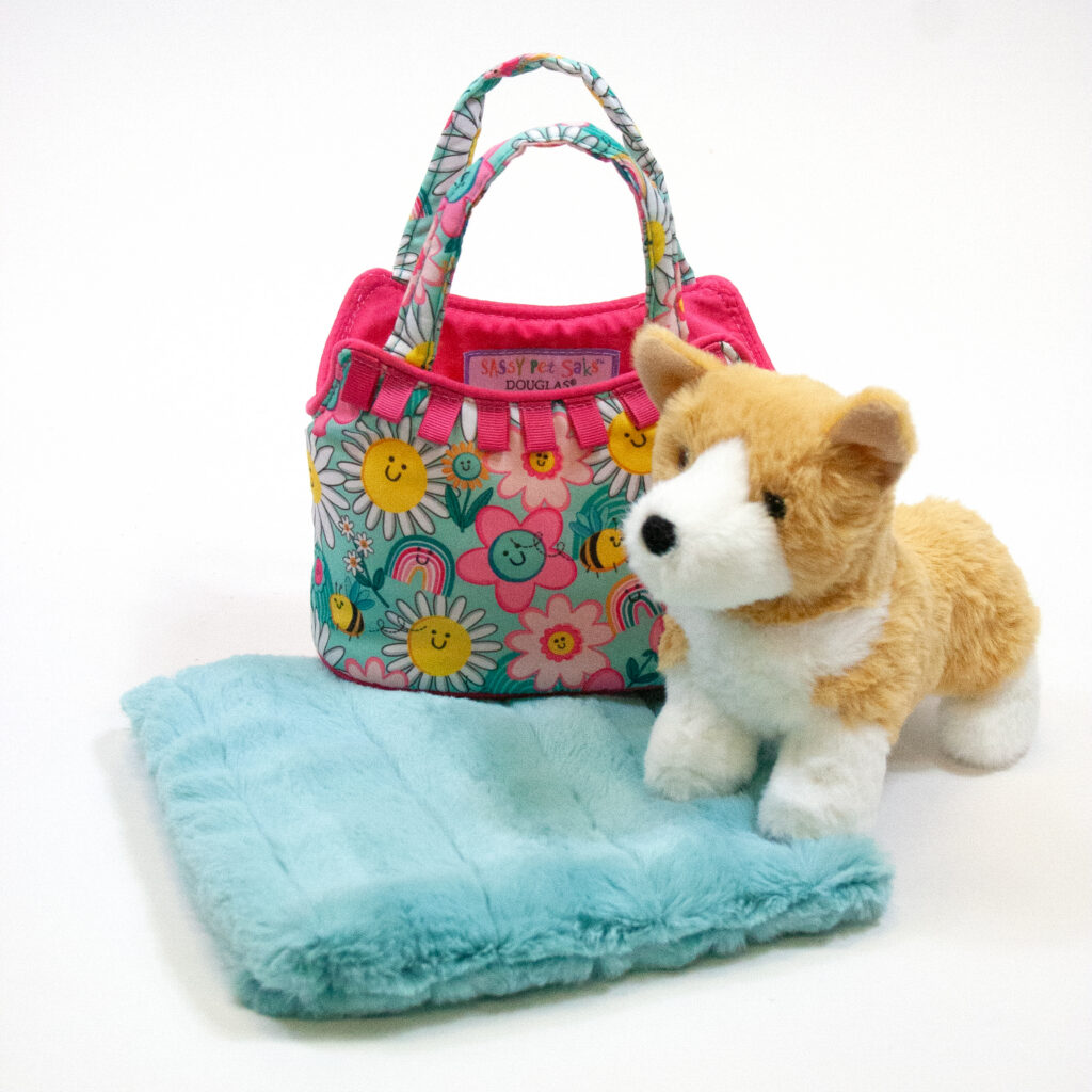 Corgi Smile Sack has a plush corgi and a floral-patterned carrying bag with a turquoise blanked